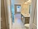 Modern bathroom featuring double vanity, framed mirrors, and tiled walk-in shower at 1044 Fairhaven Dr # 100, Mebane, NC 27302
