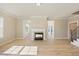 Spacious living room featuring wood floors and fireplace at 1044 Fairhaven Dr # 100, Mebane, NC 27302
