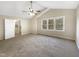 Spacious bedroom with ceiling fan and carpet at 12905 Barsanlaw Dr, Raleigh, NC 27613