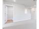 Open bedroom featuring neutral carpet, recessed lighting, and an open doorway at 305 Little Creek Dr, Lillington, NC 27546