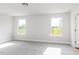 Carpeted bedroom with natural light from windows with outside views at 305 Little Creek Dr, Lillington, NC 27546