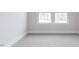 Cozy bedroom featuring soft carpet and bright windows with natural light at 305 Little Creek Dr, Lillington, NC 27546