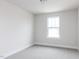 Bright bedroom with a window offering ample natural light and neutral carpet at 305 Little Creek Dr, Lillington, NC 27546