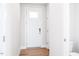 Bright entryway featuring clean lines, modern fixtures, and wood-look flooring at 305 Little Creek Dr, Lillington, NC 27546