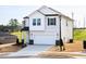 Beautiful two-story home with a 2-car garage, neutral siding, and well-maintained landscaping at 305 Little Creek Dr, Lillington, NC 27546