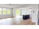 Open floor plan combining kitchen and living spaces with natural light at 305 Little Creek Dr, Lillington, NC 27546