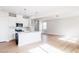 Open floor plan combining kitchen and living spaces with natural light at 305 Little Creek Dr, Lillington, NC 27546