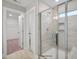 Bright bathroom with a glass-enclosed shower, tiled walls, and modern fixtures at 34 Macy Cir, Wendell, NC 27591