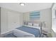 Comfortable bedroom featuring a cozy bed with bright lamps and artwork above the bed at 34 Macy Cir, Wendell, NC 27591