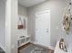 Entryway with coat rack, shoe storage, and a welcome mat at 34 Macy Cir, Wendell, NC 27591