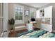 Comfortable home office featuring built-in shelves, a large window, and stylish décor at 34 Macy Cir, Wendell, NC 27591