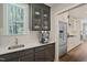 Modern kitchen featuring stainless steel appliances, bright white countertops, and gray cabinetry at 34 Macy Cir, Wendell, NC 27591