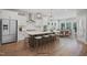 Modern kitchen featuring a large island with seating, stainless steel appliances, and hardwood floors at 34 Macy Cir, Wendell, NC 27591