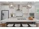 Modern kitchen featuring a large island, stainless steel appliances, and pendant lighting at 34 Macy Cir, Wendell, NC 27591