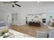 Open living room featuring a view of the kitchen with a large kitchen island and hardwood floors at 34 Macy Cir, Wendell, NC 27591