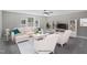 Bright living room with a sectional sofa, two chairs, and carpeted floor at 34 Macy Cir, Wendell, NC 27591