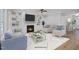 Inviting living room with a fireplace, built-in bookshelves, and comfortable seating at 34 Macy Cir, Wendell, NC 27591