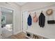 Mudroom with coat hooks, storage bench, and view into the bedroom at 34 Macy Cir, Wendell, NC 27591