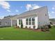 Backyard of home with green lawn and patio at 624 Gainer Dr # 17, Raleigh, NC 27610