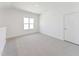 Bedroom with carpet, a window, and a door at 624 Gainer Dr # 17, Raleigh, NC 27610