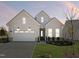 Beautiful home featuring a classic design, set against a backdrop of a lovely sunset at 624 Gainer Dr # 17, Raleigh, NC 27610