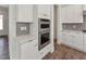Gourmet kitchen appliances, including double ovens and custom cabinetry at 624 Gainer Dr # 17, Raleigh, NC 27610