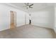 Bedroom with a trey ceiling, neutral carpet, and access to ensuite at 205 Mugby Rd # 173, Raleigh, NC 27610
