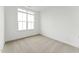 Bedroom with neutral carpet and large window at 205 Mugby Rd # 173, Raleigh, NC 27610