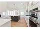 Elegant kitchen boasting modern appliances, a stylish island, and an open layout for easy entertaining at 205 Mugby Rd # 173, Raleigh, NC 27610