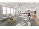 Open-concept living room features a modern interior design with an adjacent kitchen and lots of natural light at 205 Mugby Rd # 173, Raleigh, NC 27610