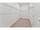 Walk-in closet with shelving and carpet at 205 Mugby Rd # 173, Raleigh, NC 27610