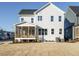 Expansive backyard features a screened porch and level homesite, perfect for outdoor living and recreation at 100 Mossy Falls Way, Wendell, NC 27591