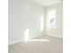 Sunny carpeted bedroom with large window providing natural light at 100 Mossy Falls Way, Wendell, NC 27591