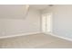 Spacious upper level bonus room featuring double glass doors at 100 Mossy Falls Way, Wendell, NC 27591