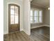 Entryway featuring hardwood floors, a wood door, and bright natural light at 100 Mossy Falls Way, Wendell, NC 27591