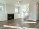 Living room with a black fireplace and built-in white cabinets at 100 Mossy Falls Way, Wendell, NC 27591