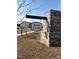 Stone monument sign for the Avery Chase community under a clear blue sky at 216 Bruce Dr, Dunn, NC 28334