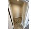 Laundry room with tile floors, neutral paint, and a wire rack for storage at 216 Bruce Dr, Dunn, NC 28334