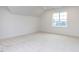 Spacious carpeted bedroom featuring ample natural light and neutral paint at 1253 Barreto Dr, Wendell, NC 27591