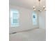Bright bedroom with ample windows and modern lighting fixture at 1253 Barreto Dr, Wendell, NC 27591
