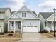 Charming home with a two-car garage, stone accents, and a welcoming front porch at 1253 Barreto Dr, Wendell, NC 27591