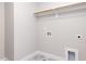 Well-lit laundry room with tile flooring and necessary hookups at 1253 Barreto Dr, Wendell, NC 27591