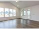Bright living room with large windows and back door access at 1253 Barreto Dr, Wendell, NC 27591