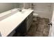 Bathroom featuring a single sink vanity with a quartz countertop and a combination shower and bathtub at 158 Citizens Ct # 32, Four Oaks, NC 27524
