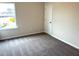 This bedroom features neutral walls, carpeted floors, a window, and a closet at 158 Citizens Ct # 32, Four Oaks, NC 27524