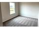 This bedroom has neutral walls, carpeted floors, and a window with natural light at 158 Citizens Ct # 32, Four Oaks, NC 27524