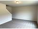 Spacious room with neutral walls and new carpet on the second floor of the home at 158 Citizens Ct # 32, Four Oaks, NC 27524