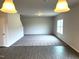Spacious living room with new carpet and hardwood flooring leading to an adjacent room at 158 Citizens Ct # 32, Four Oaks, NC 27524