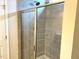 Modern bathroom with a glass-enclosed shower and gray tiled walls at 158 Citizens Ct # 32, Four Oaks, NC 27524