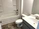 Clean bathroom featuring a tub and shower combination with gray tile flooring at 346 Olivia Crossing Ct # 12, Four Oaks, NC 27524